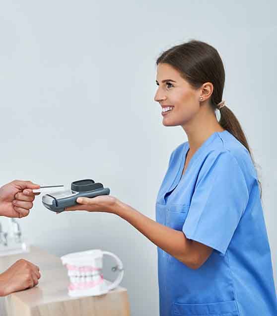 patient paying the dental office