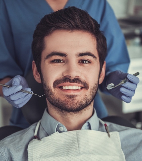 Man smiling during emergency dentistry visit