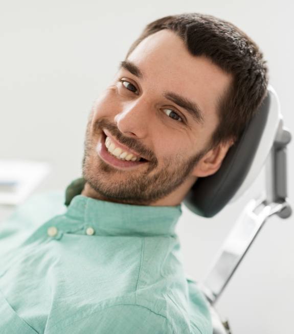 Man smiling after periodontal pathology visit