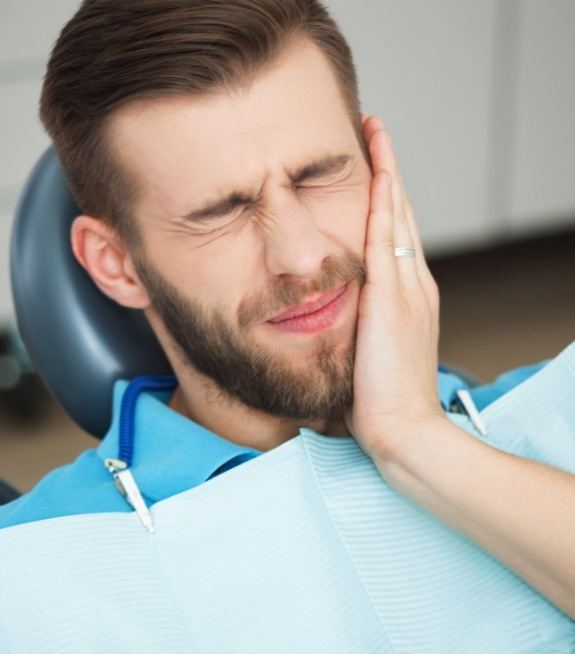 Man in pain before gum disease treatment