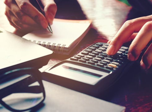 Woman using a calculator