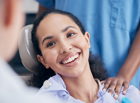 a dental patient smiling during an appointment