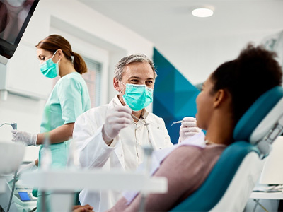 Dentist giving a patient a dental exam