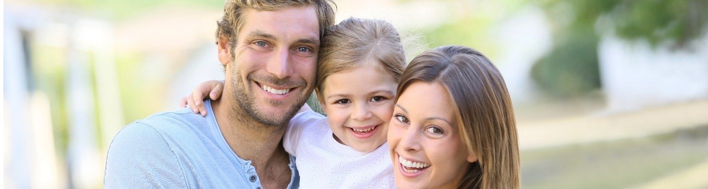 Family smiling after periodontal services