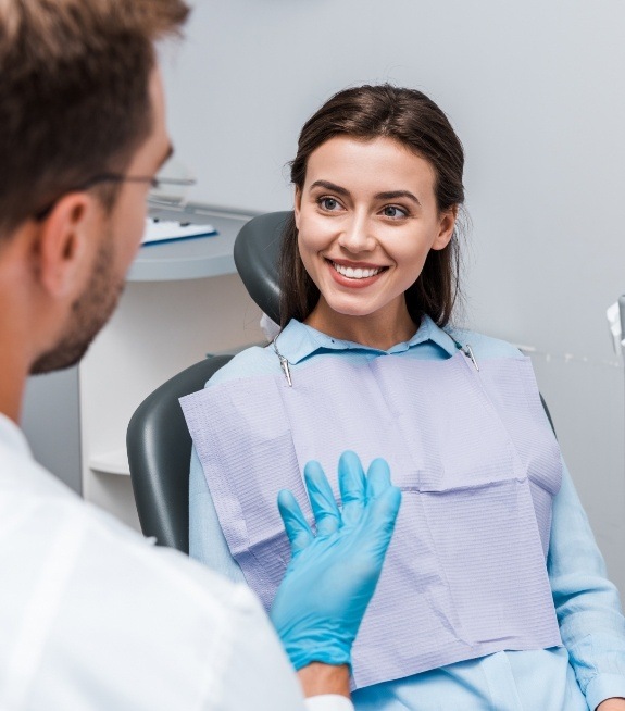 Woman smiling at dentist during periodontal diagnostic visit